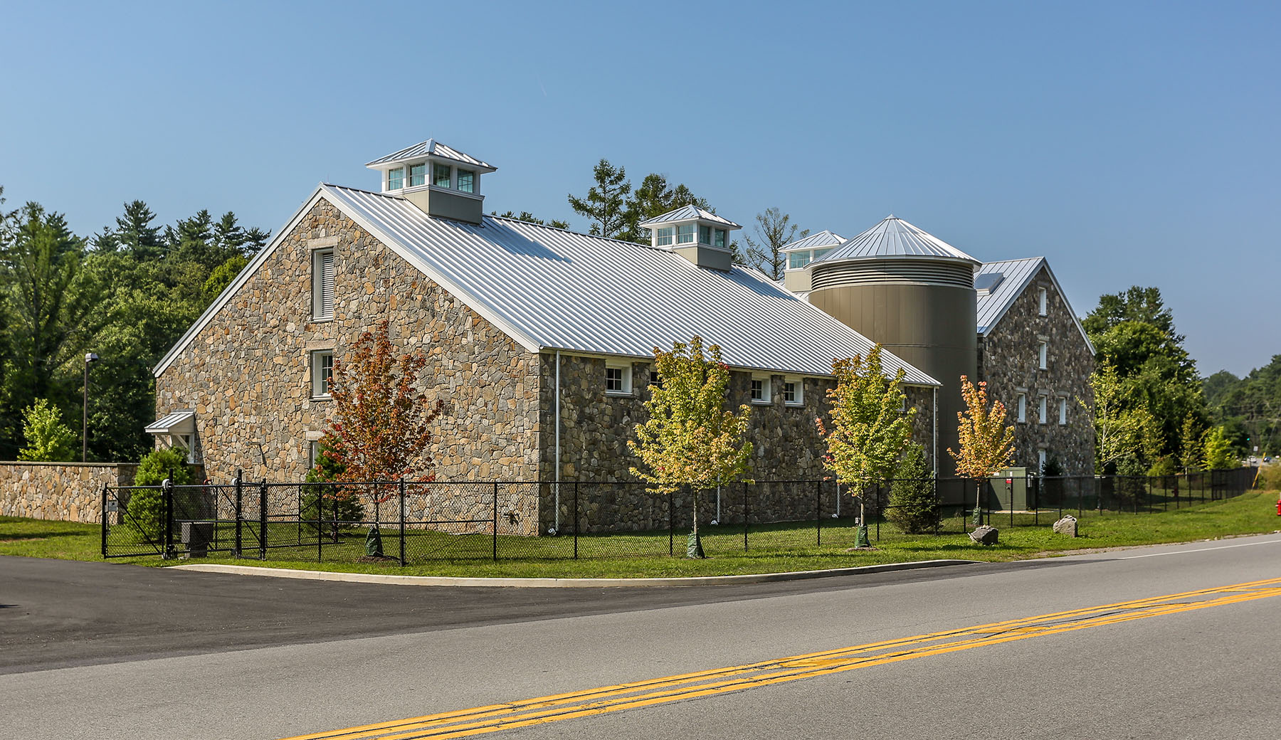 The Bedford Water Treatment Plant was designed to fit into the vernacular of the town. The Town of Bedford is a rural town with many large estates and horse farms and large barns. 
