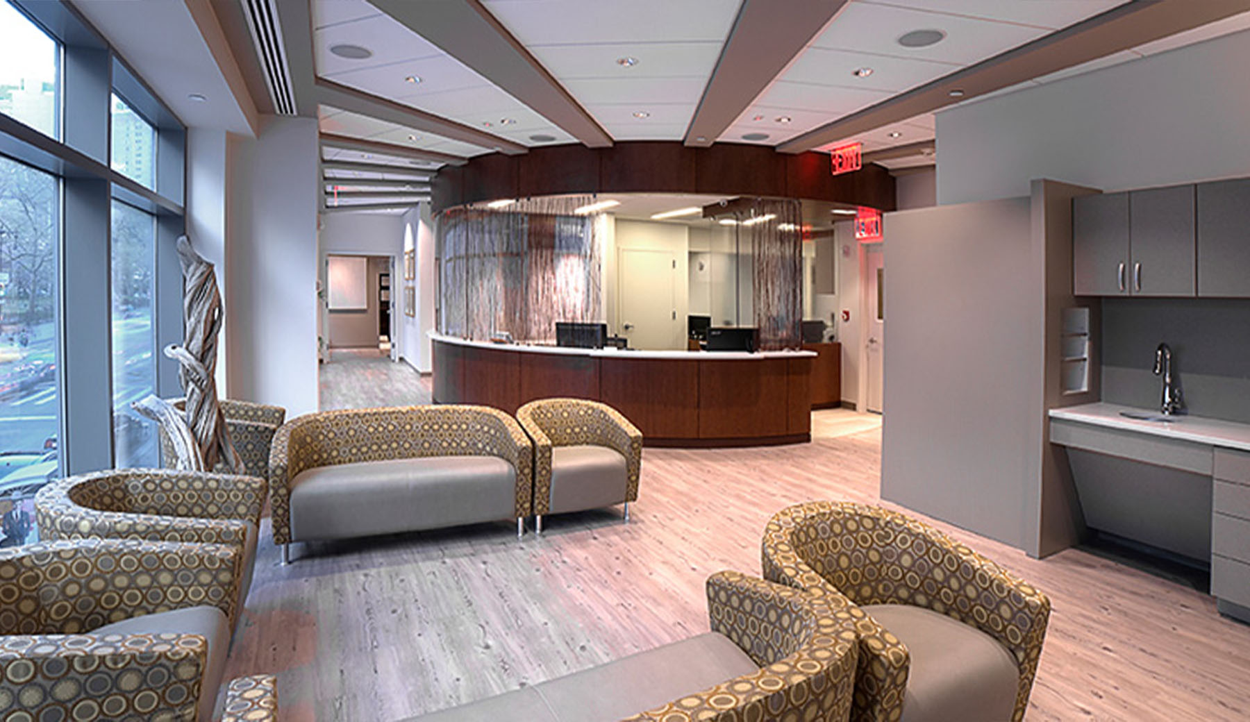 Waiting Area and Patient Check in overlooking Broadway.  Radial ceiling splays from the Nurse's check in area.  