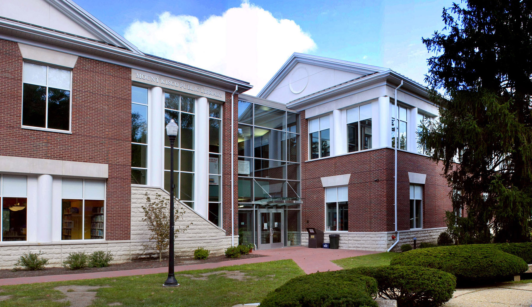 The Mount Kisco Public Library is a new 18,000 square foot Library building with a geothermal heating system. The glass atrium entrance (above) has direct access into the children’s library, and community room reading room.