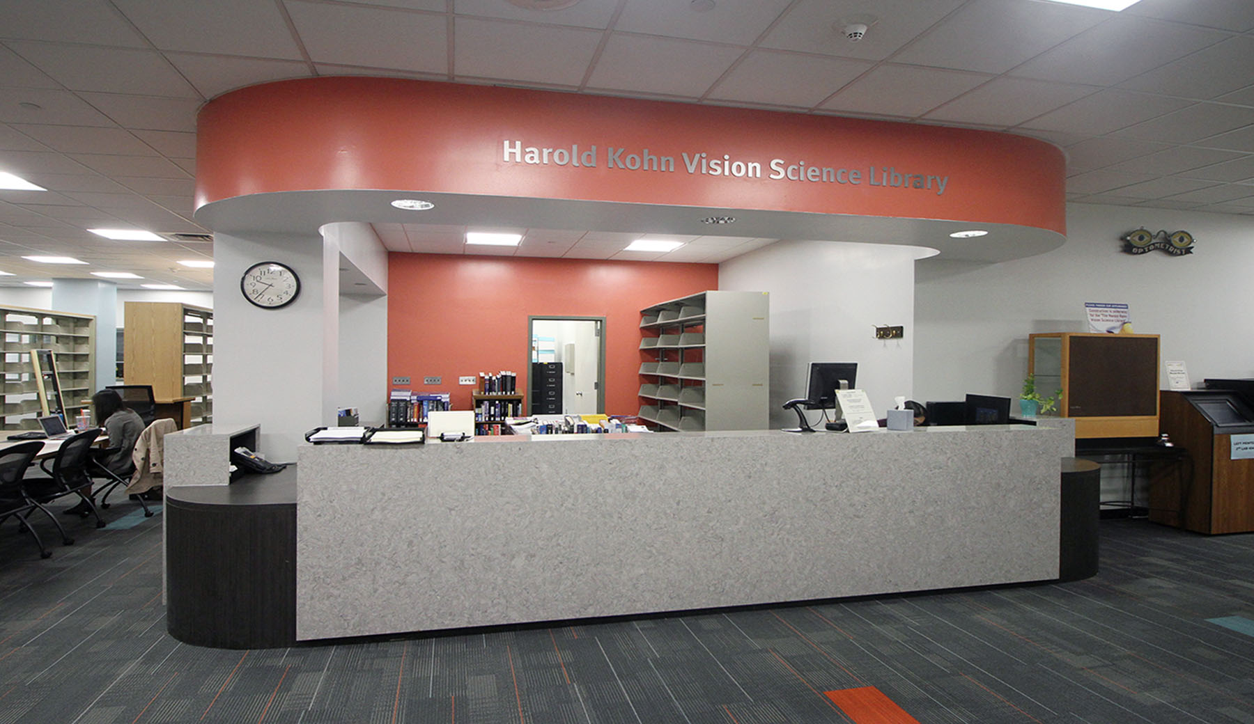 A custom designed Circulation Desk is the focal point upon entry to the Harold Kohn Vision Science Library at the SUNY College of Optometry. It accomplishes Universal Design by incorporating transaction surfaces at varying heights. The use of quartz and high-pressure laminate creates a high-end look while offering durability for the high traffic space.